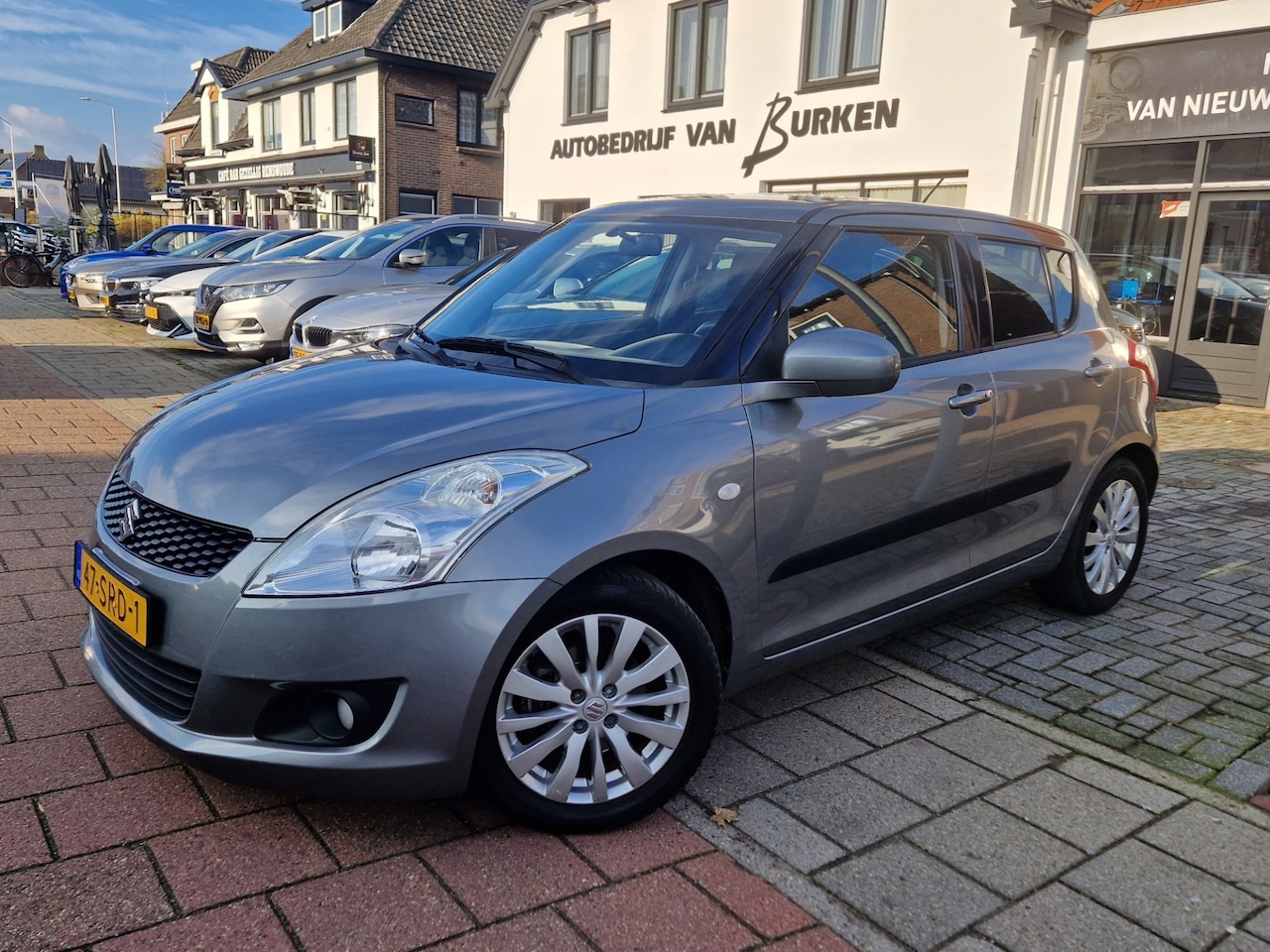 Suzuki Swift - 1.2 Exclusive 1.2 Exclusive, Climate control,Stoelverwarming,L.M.Velgen,Cruise control - AutoWereld.nl