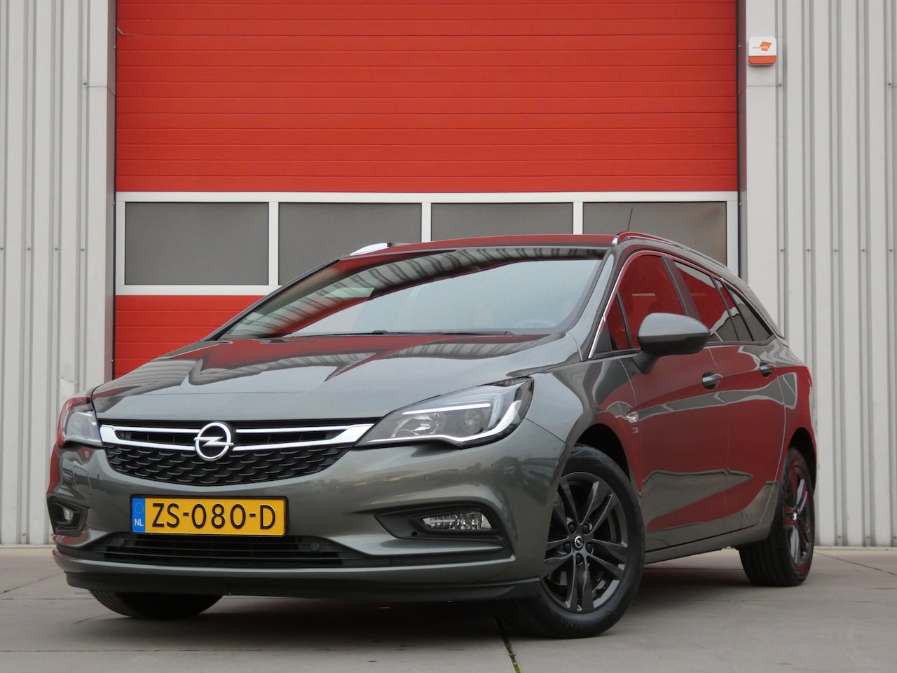 Opel Astra Sports Tourer - 1.0 Turbo 120 Jaar Edition/ lage km/ zeer mooi! - AutoWereld.nl