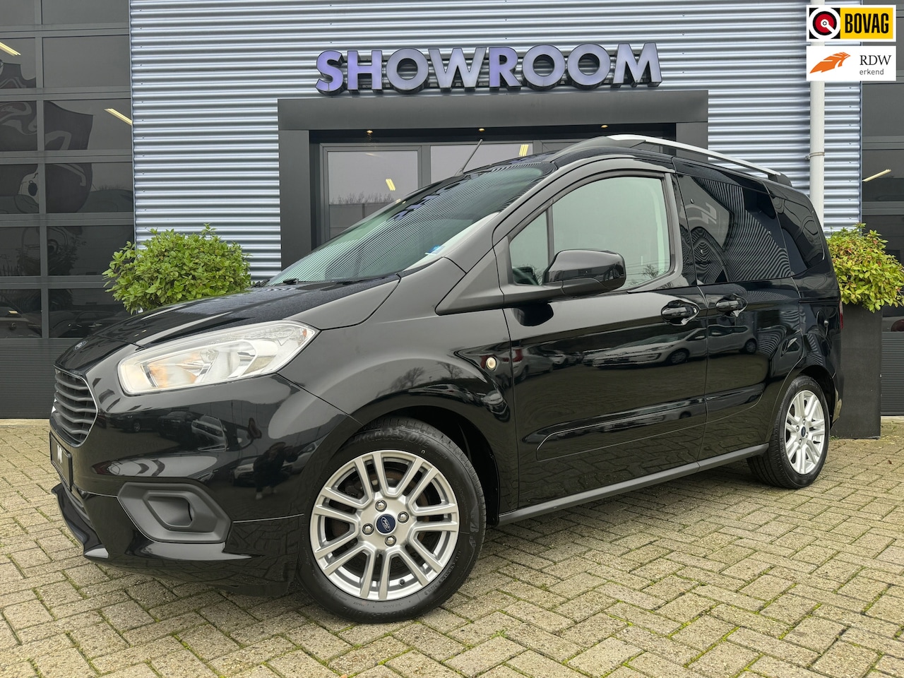 Ford Tourneo Courier - 1.0 Titanium Airco|Stoelverwarming|Navi|Cruisecontrol|Camera|Apple carplay - AutoWereld.nl