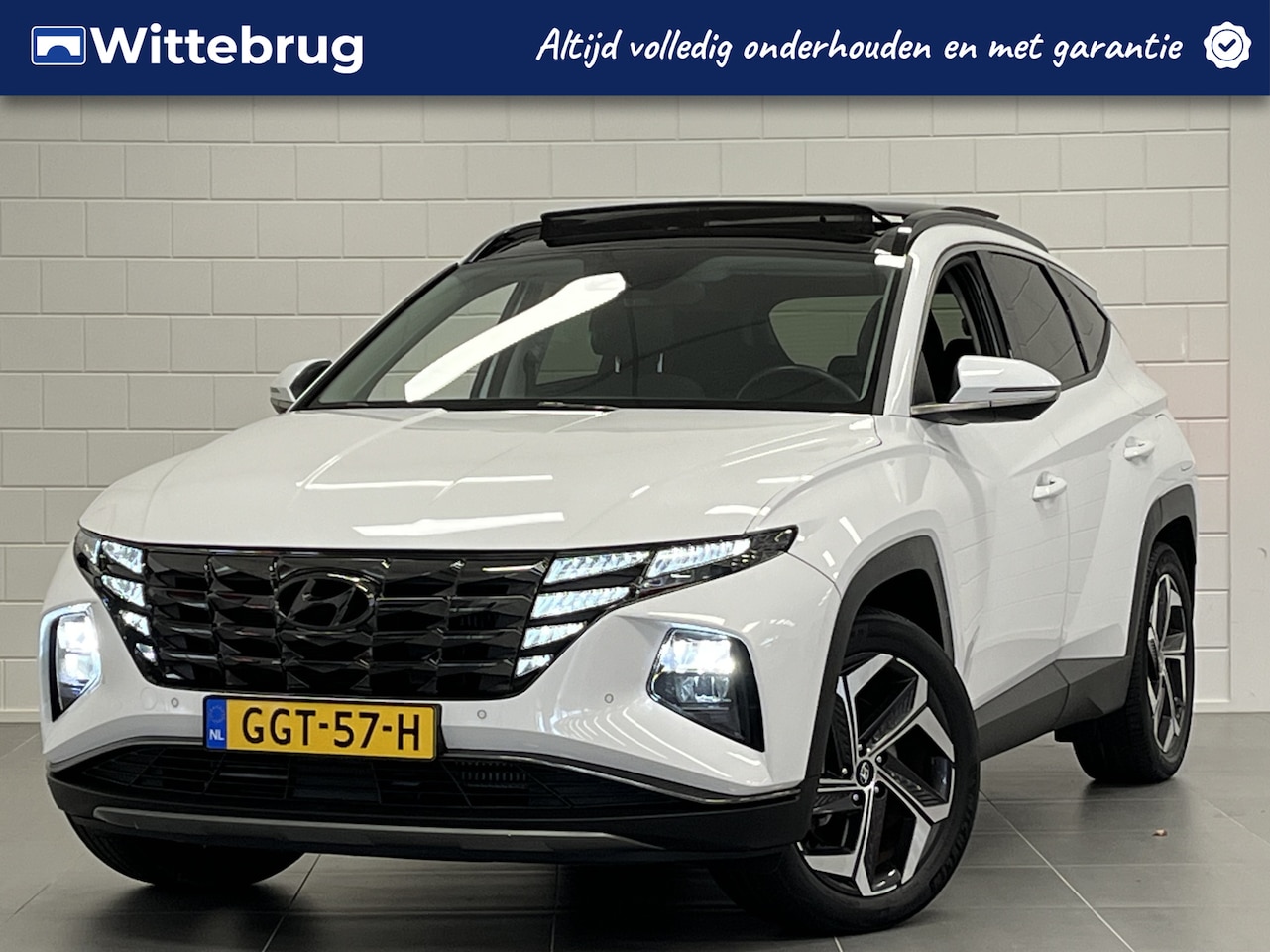 Hyundai Tucson - 1.6 T-GDI PHEV Comfort Sky 4WD | PANORAMADAK | STOELVERWARMING | NAVIGATIE | PARKEERCAMERA - AutoWereld.nl