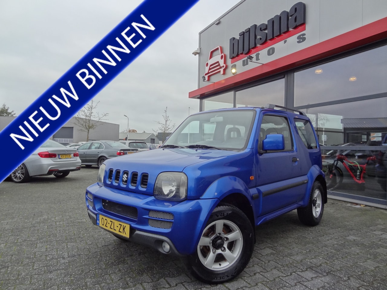 Suzuki Jimny - 1.3 Exclusive 4WD | NL-AUTO | AIRCO | AFN. TREKHAAK | LMV | - AutoWereld.nl