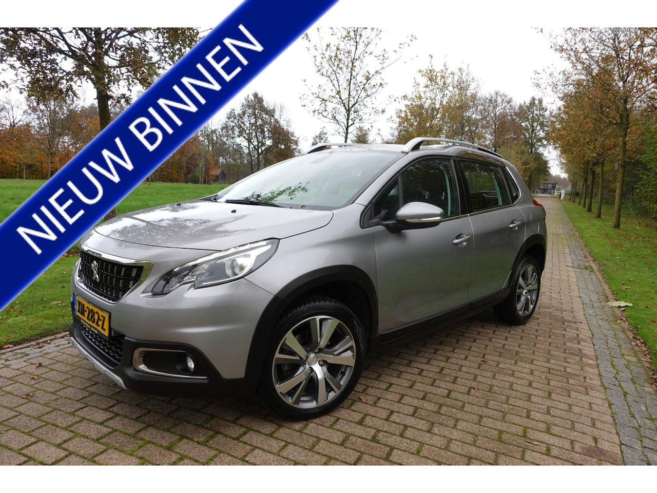 Peugeot 2008 - 1.2 PureTech Allure Trekhaak Airco Allseason banden - AutoWereld.nl