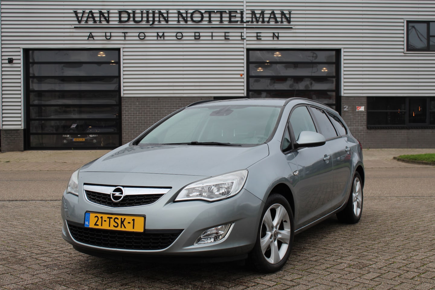 Opel Astra Sports Tourer - 1.4 Turbo Edition / Airco / Cruise / Trekhaak / N.A.P. - AutoWereld.nl