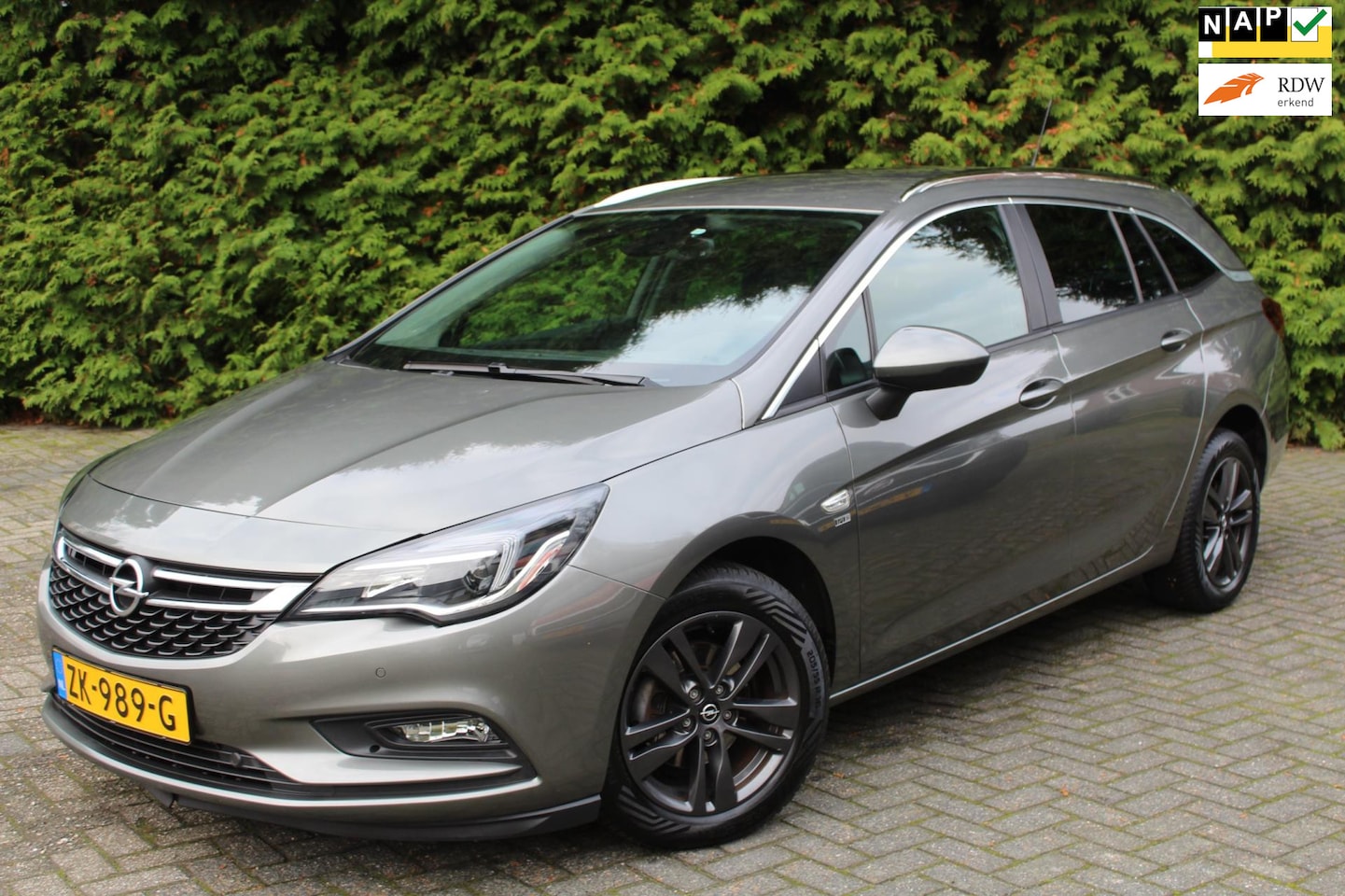 Opel Astra Sports Tourer - 1.0 Turbo 120 Jaar Edition 105PK | Climate Control | LMV | NAVI | Cruise Control | PDC V+A - AutoWereld.nl