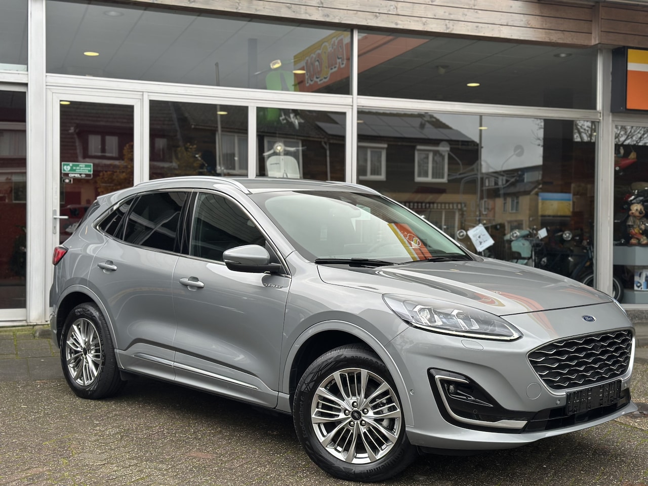 Ford Kuga - 2.5 PHEV Vignale Leder/Stoel en stuur verwarming/B&O/Camera. - AutoWereld.nl