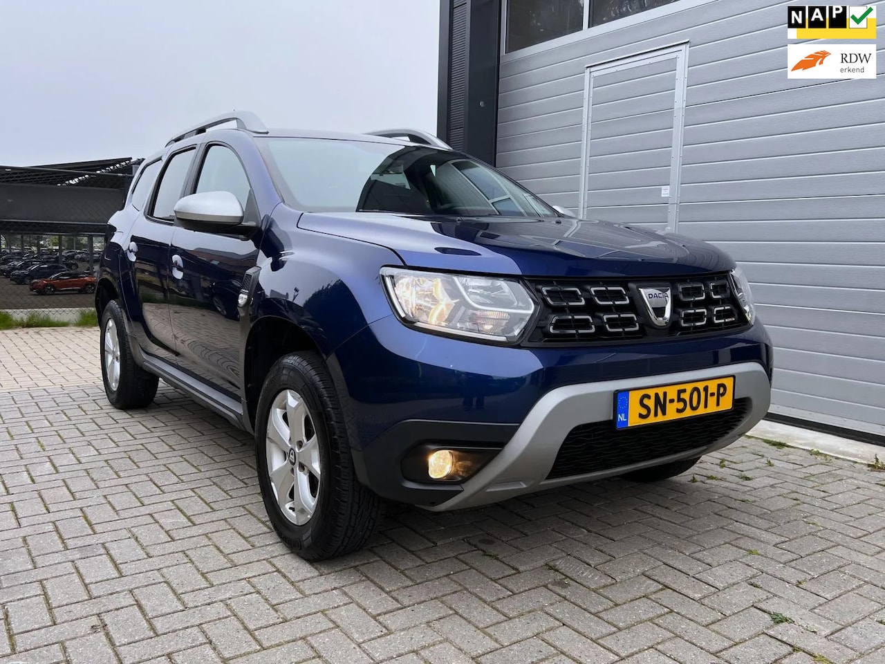 Dacia Duster - 1.2 TCe Comfort - PDC - Trekhaak (1.500 kg) - Bluetooth - Lichtsensor - Nieuwe APK - AutoWereld.nl