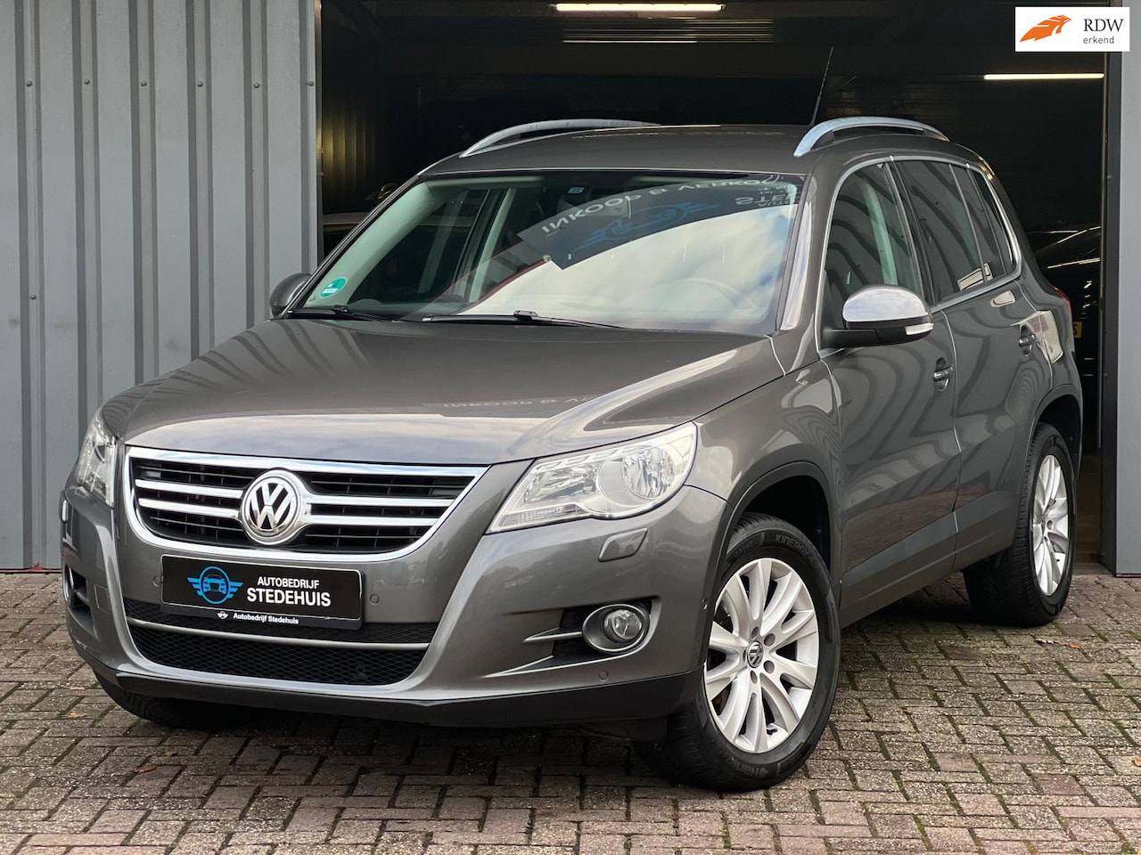 Volkswagen Tiguan - 1.4 TSI Sport&Style CarPlay l PDC - AutoWereld.nl