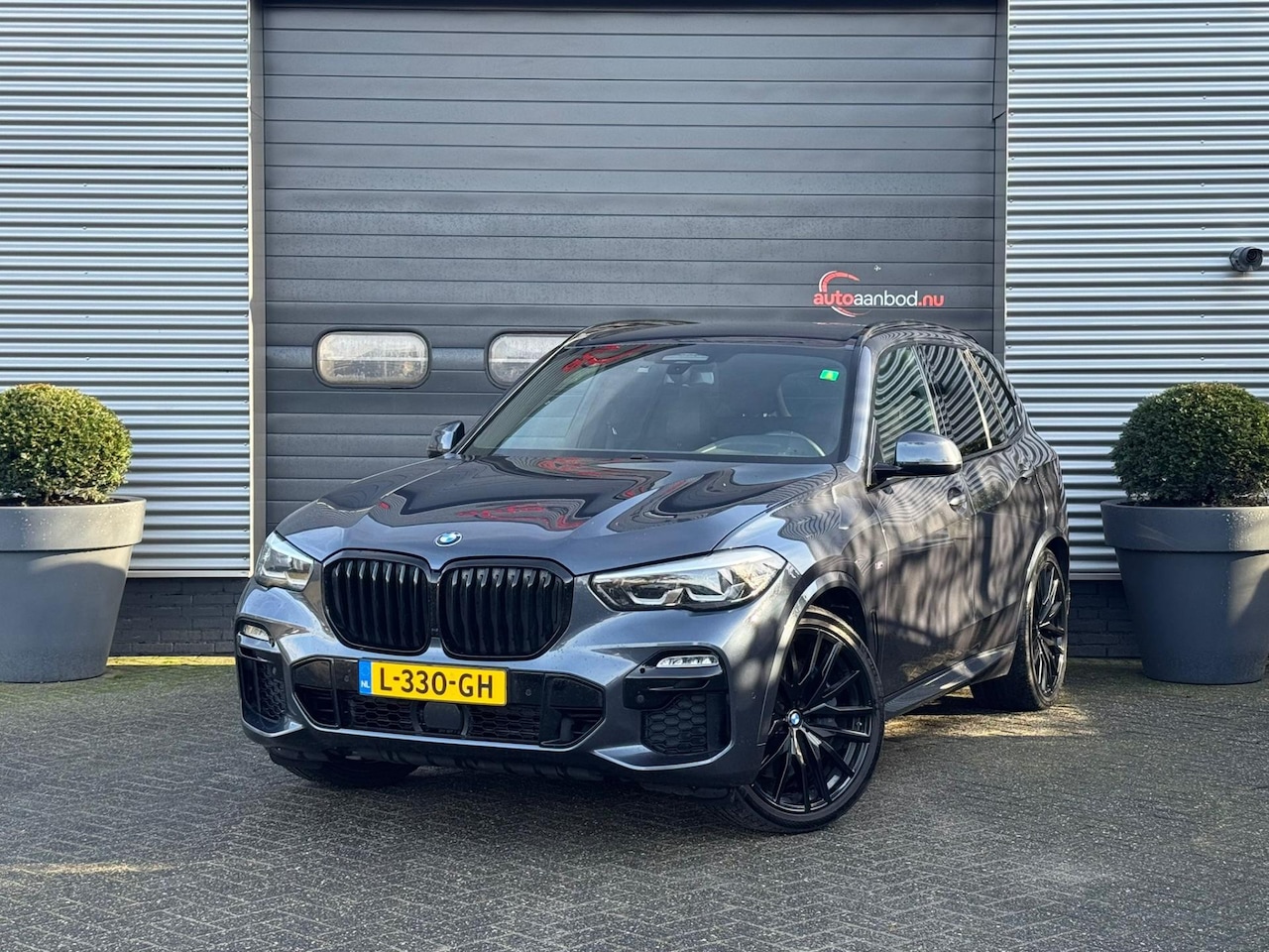 BMW X5 - XDrive30d High Executive 7p. M-Sport | Luchtvering | 22 Inch Lichtmetalen Velgen | Stoel/S - AutoWereld.nl