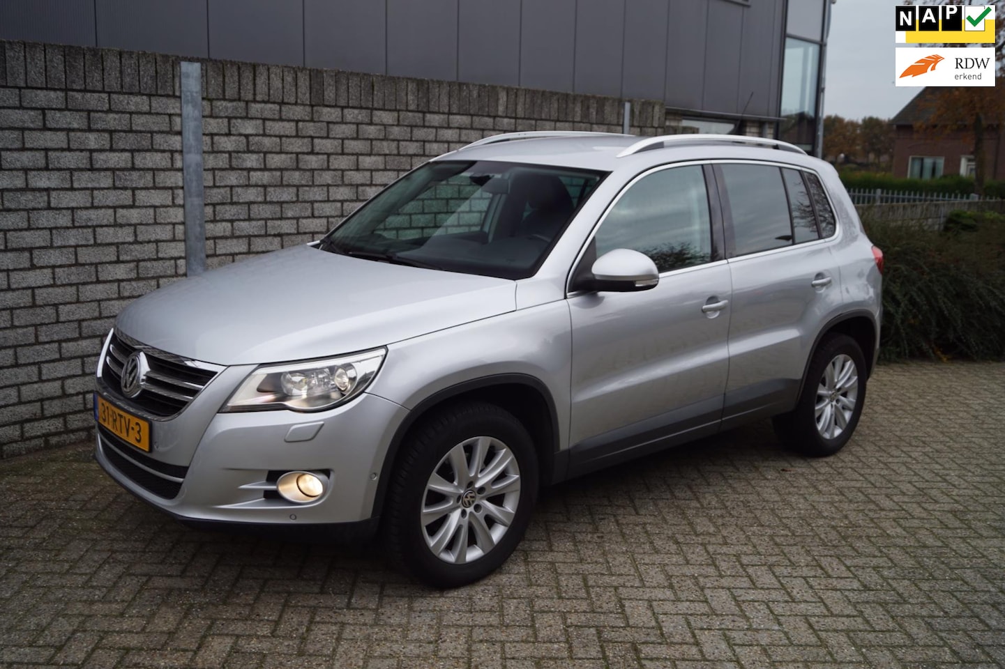 Volkswagen Tiguan - 2.0 TSI Sport&Style 4Motion 200PK Autom Leder Stoeverw Navi Camera Clima Cruise Xenon 2x P - AutoWereld.nl