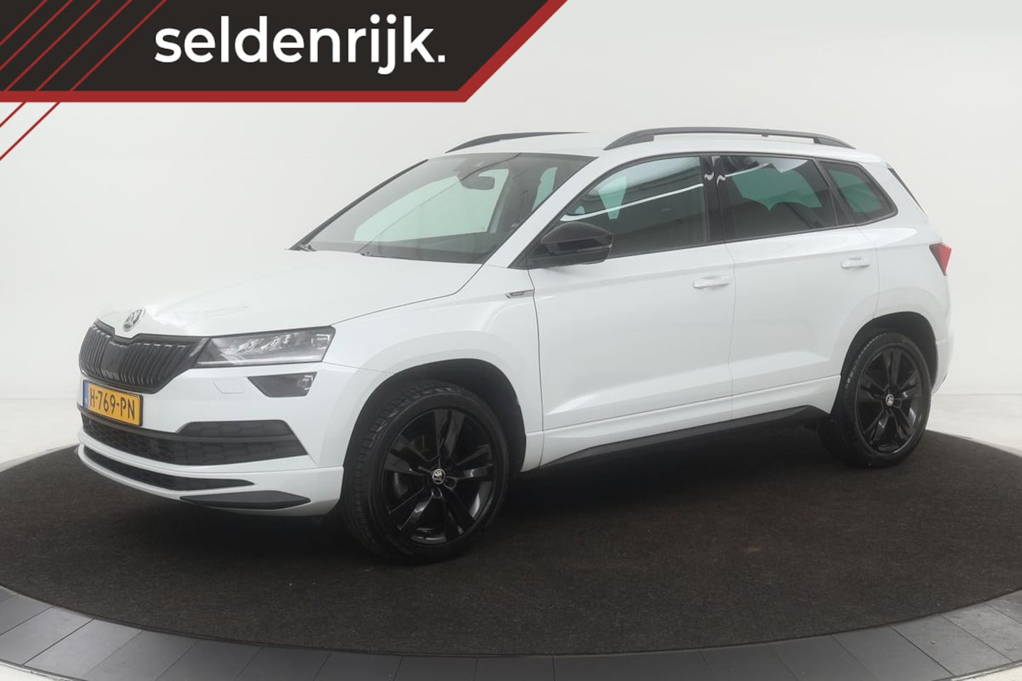 Skoda Karoq - 1.5 TSI Sportline | Trekhaak | Adaptive cruise | Stoelverwarming | Carplay | Camera | Full - AutoWereld.nl