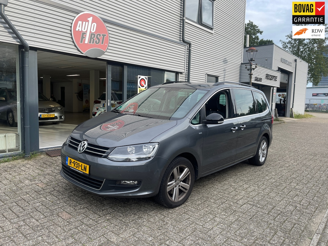 Volkswagen Sharan - 1.4 TSI Highline 7p. / Airco ACC / cruise controle / trekhaak / PDC - AutoWereld.nl