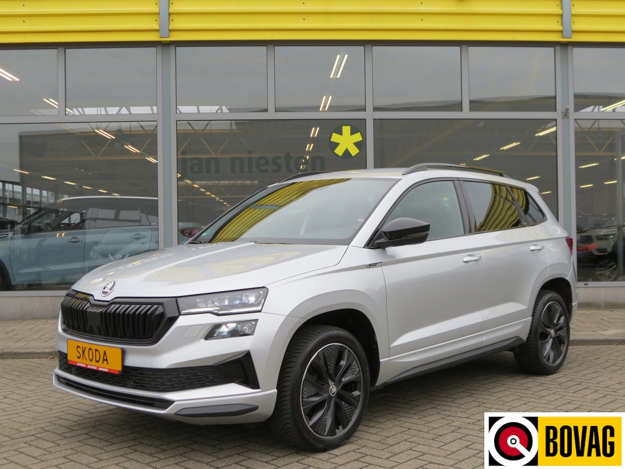 Skoda Karoq - 1.5 TSI AUTOMAAT / SPORTLINE / NAVI / ADAPTIVE CRUISE - AutoWereld.nl