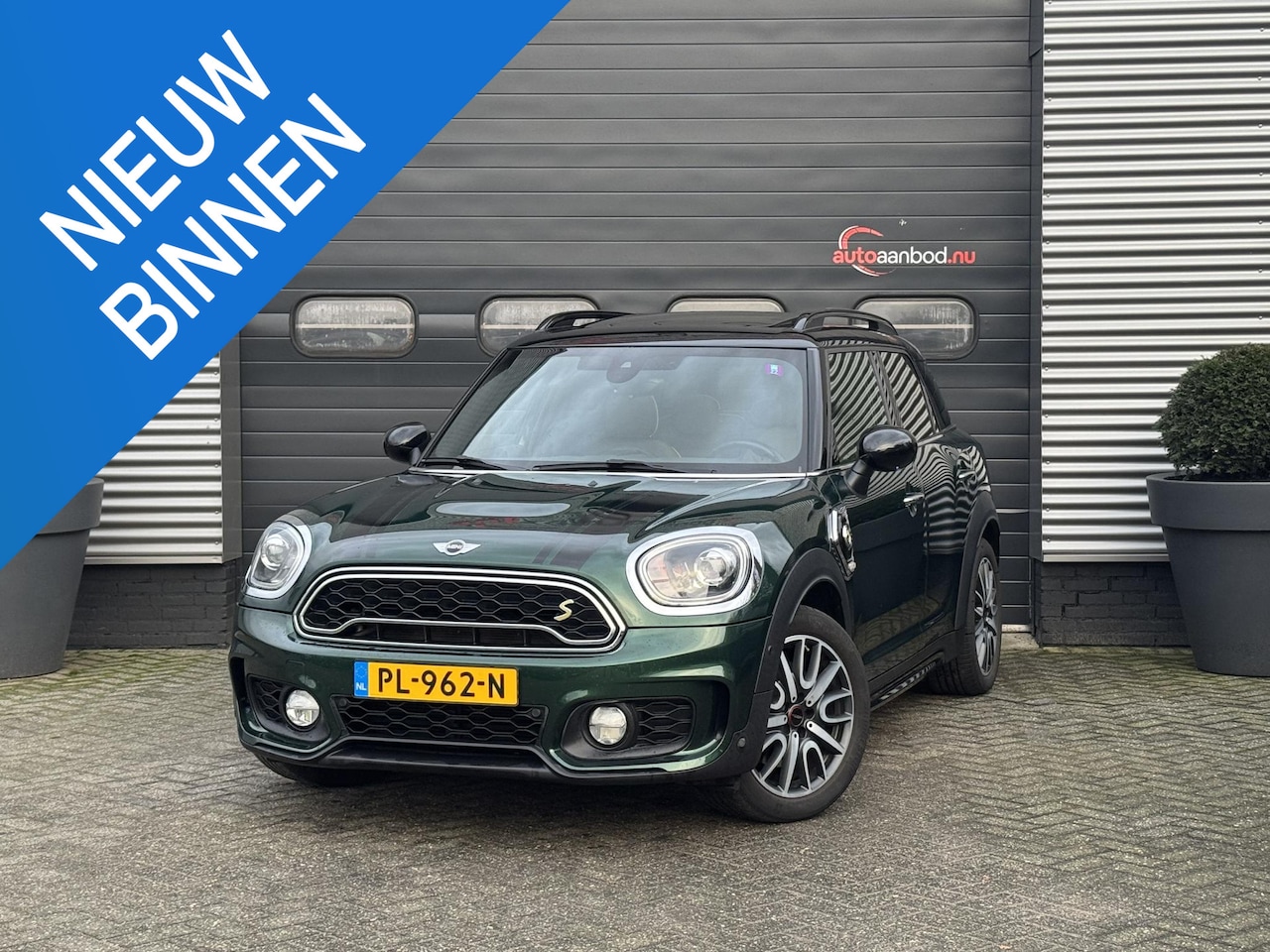 MINI Countryman - Mini 2.0 Cooper S E ALL4 Chili | JCW | Panoramadak | Head-Up Display | Navigatie | Lederen - AutoWereld.nl