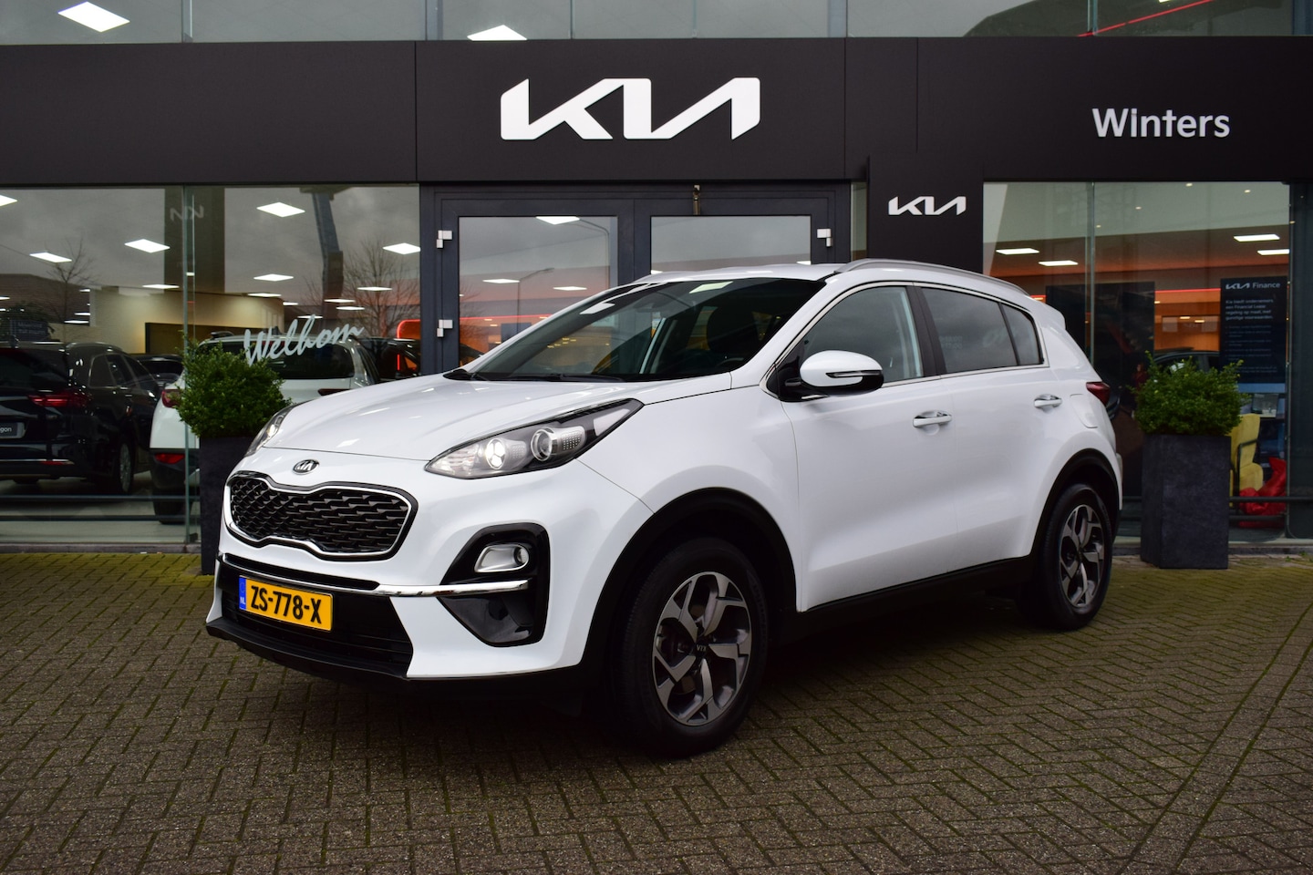 Kia Sportage - 1.6i-16V ISG DynamicLine ECC Cr.Control Navi+Camera BT+USB 17"LMV PDC LED 61.575km 7jr.Gar - AutoWereld.nl