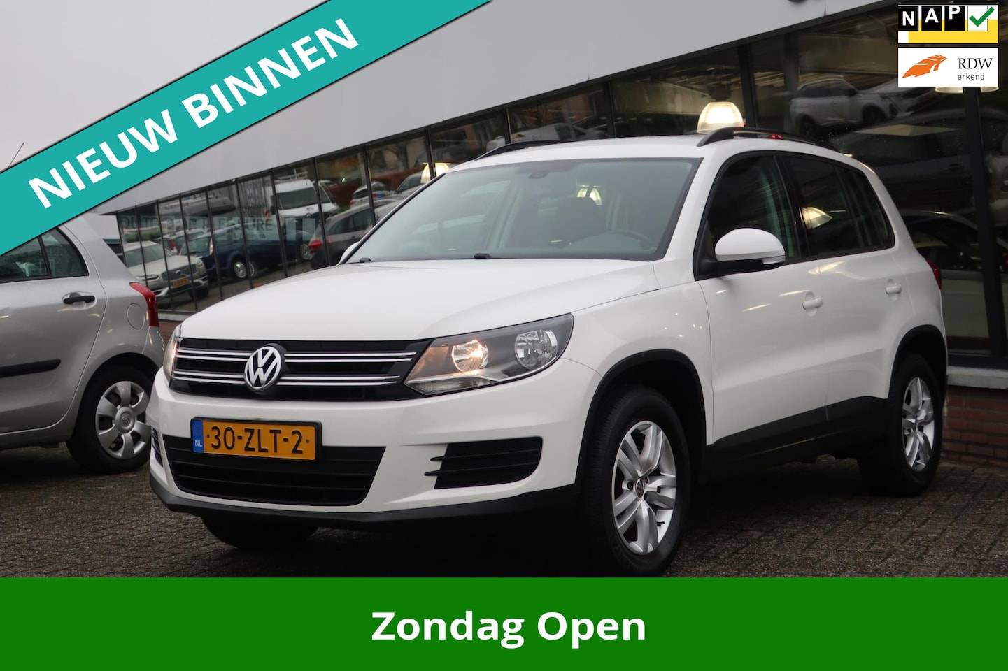 Volkswagen Tiguan - 2.0 TDI Comfort&Design 2e EIG_NAVI_PDC_LMV_NAP. - AutoWereld.nl