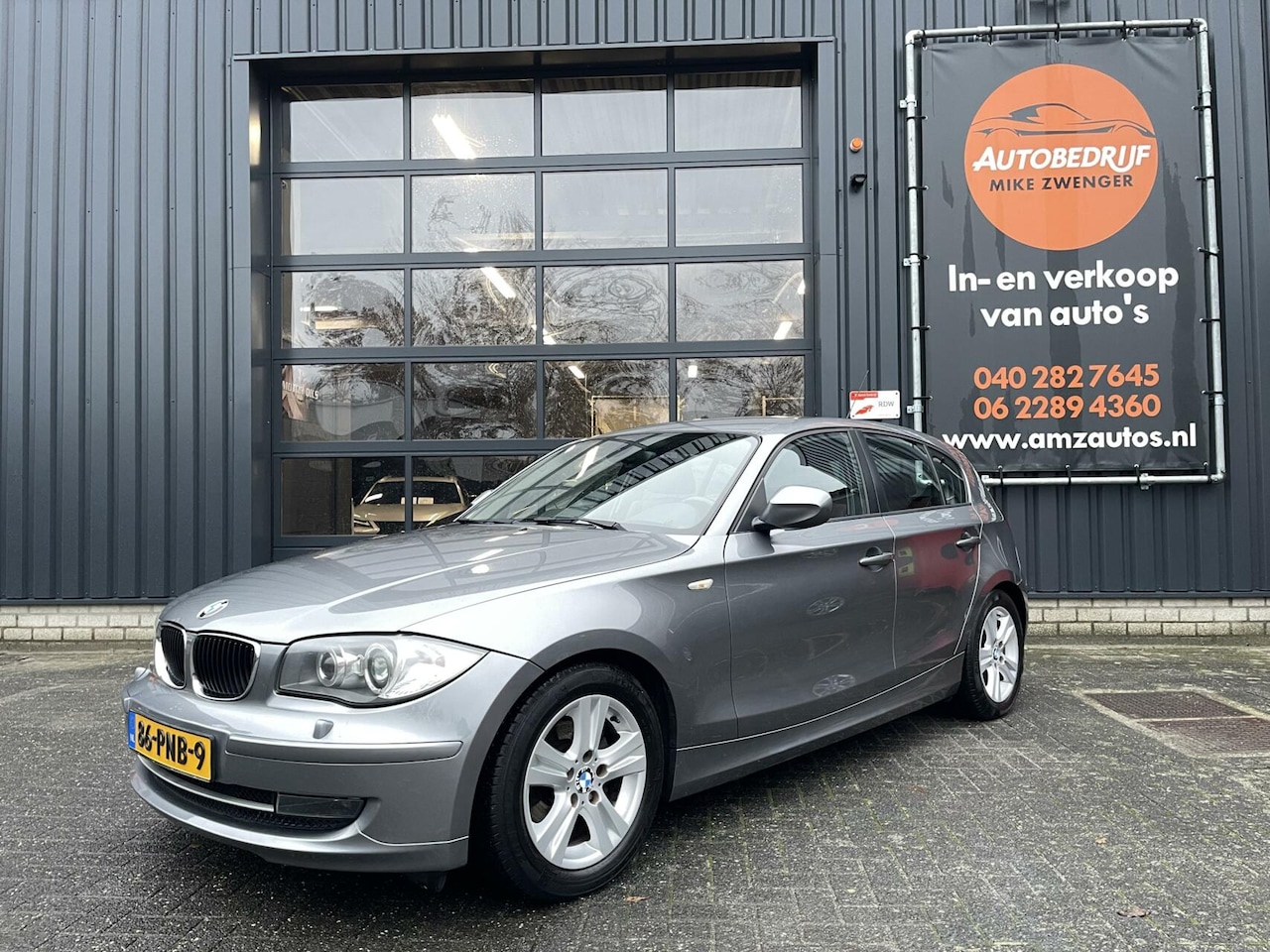 BMW 1-serie - 116i NAVIGATIE|LEER|STOELVERWARMING|XENON|PARKEERSENSORS|CRUISE CONTROL|ORIGINEEL NL - AutoWereld.nl