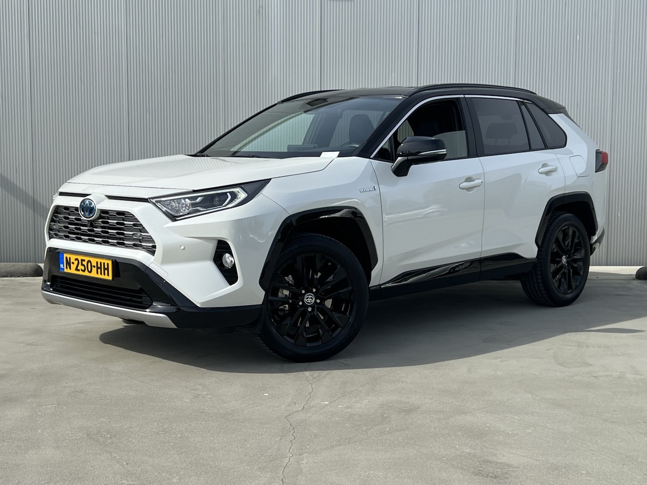 Toyota RAV4 - 2.5 Hybrid Bi-Tone Half lederen bekleding | Elektr. bedienbare achterklep | parkeersensore - AutoWereld.nl