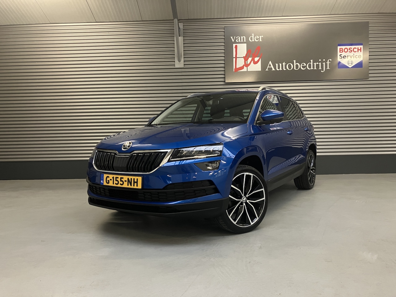 Skoda Karoq - 1.0 TSI/NAVI/PDC/CAM/TREKH/19INCH/ADAPTIVE/BLS/ENZ - AutoWereld.nl