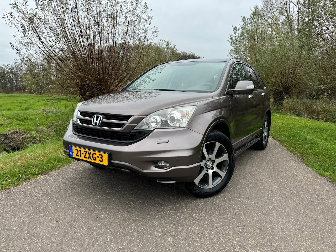 Honda CR-V - 2.0i Executive / Automaat / Camera / Stoelverwarming / Leder / Glazen dak / Climate Contro - AutoWereld.nl