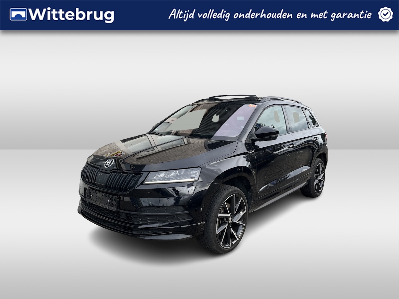 Skoda Karoq - 1.5 TSI ACT Sportline / AUTOMAAT/ PANO/ TREKHAAK/ CAMERA/ PARK. SENSOREN/ LED/ DODE HOEK/ - AutoWereld.nl