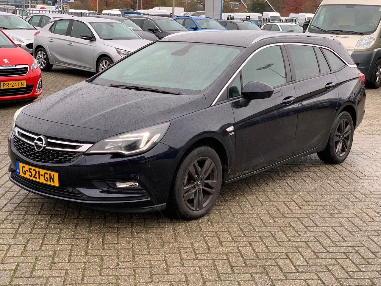 Opel Astra Sports Tourer - 1.0 Turbo 120 Jaar Ed. Navi | Camera | LED | St. Verwarming | Privacy Glass | 16" LMV | Ne - AutoWereld.nl