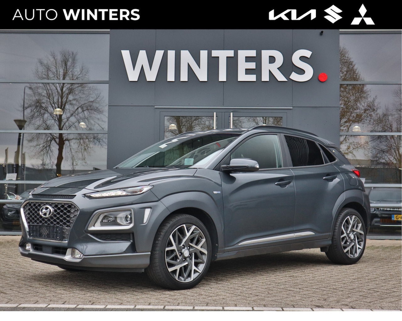 Hyundai Kona - 1.6 GDI HEV Hybrid Premium Automaat Navi+BT+Cam Cr. Control Stoel+Stuurverw. HUD PDC 18''L - AutoWereld.nl