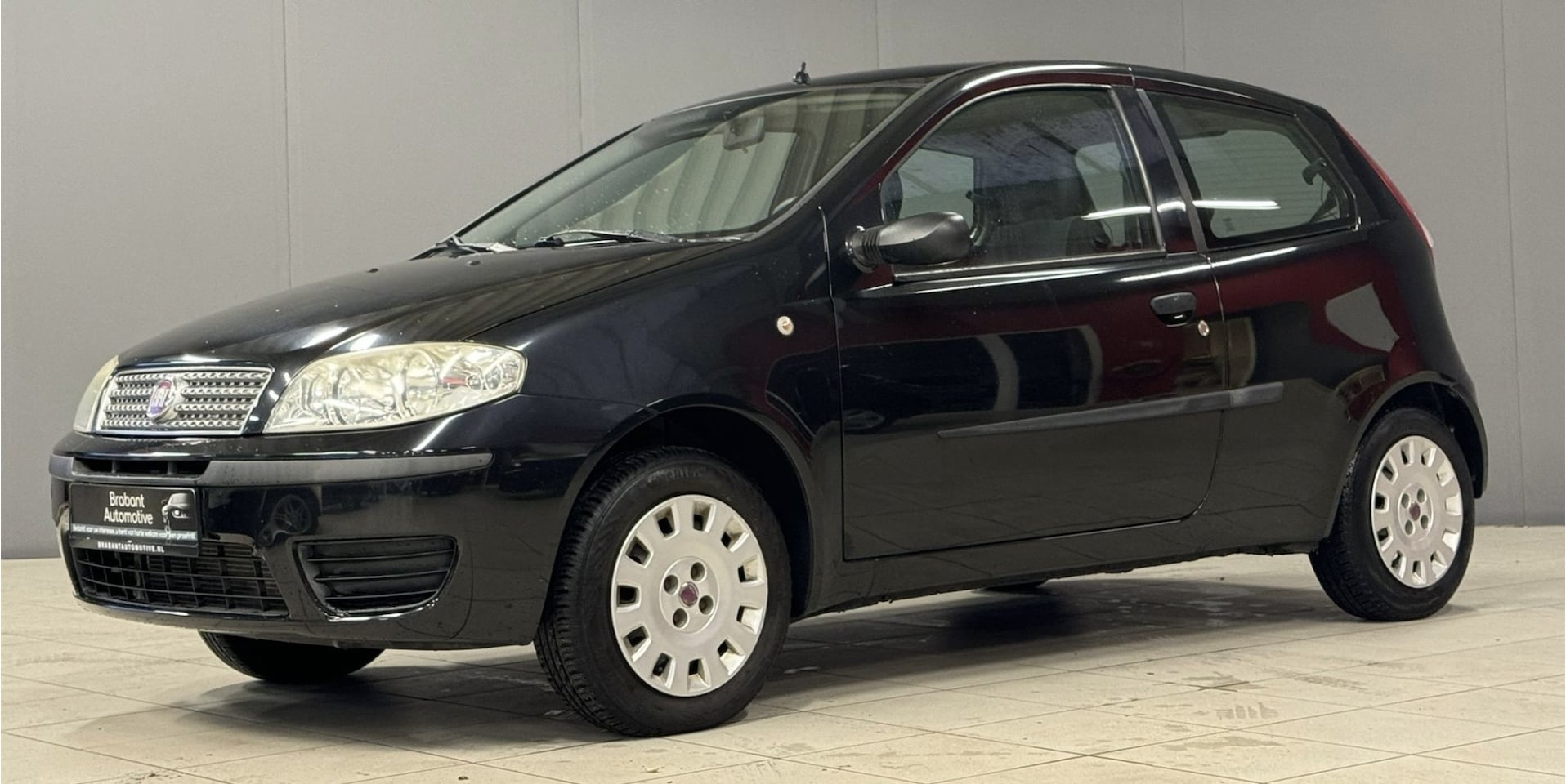 Fiat Punto - 1.2 Active 365 dagen garnantie. 2e eigenaar, extreem lage km-stand, airco 12 maanden garan - AutoWereld.nl