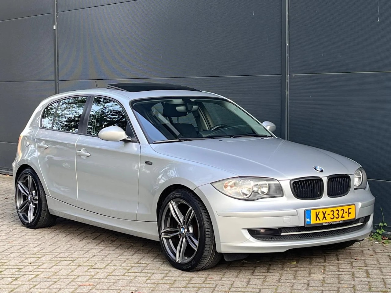 BMW 1-serie - 116i NAVI SCHUIFDAK PDC START/STOP M VELGEN - AutoWereld.nl