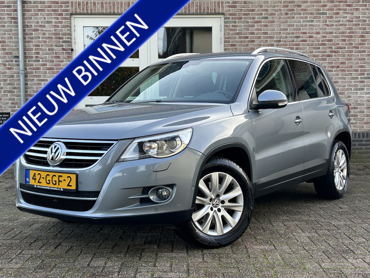 Volkswagen Tiguan - 1.4 TSI Sport&Style 4Motion Clima Trekhaak - AutoWereld.nl