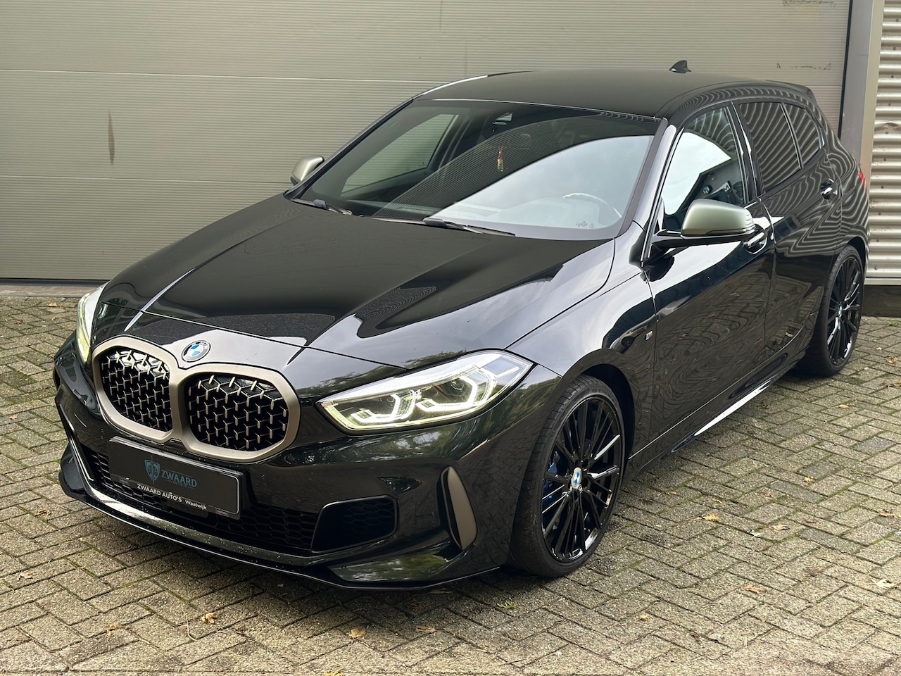 BMW 1-serie - M135i xDriveCentennial High Executive l Kuipstoelen l Navi l ACC l Performance uitlaat l - AutoWereld.nl