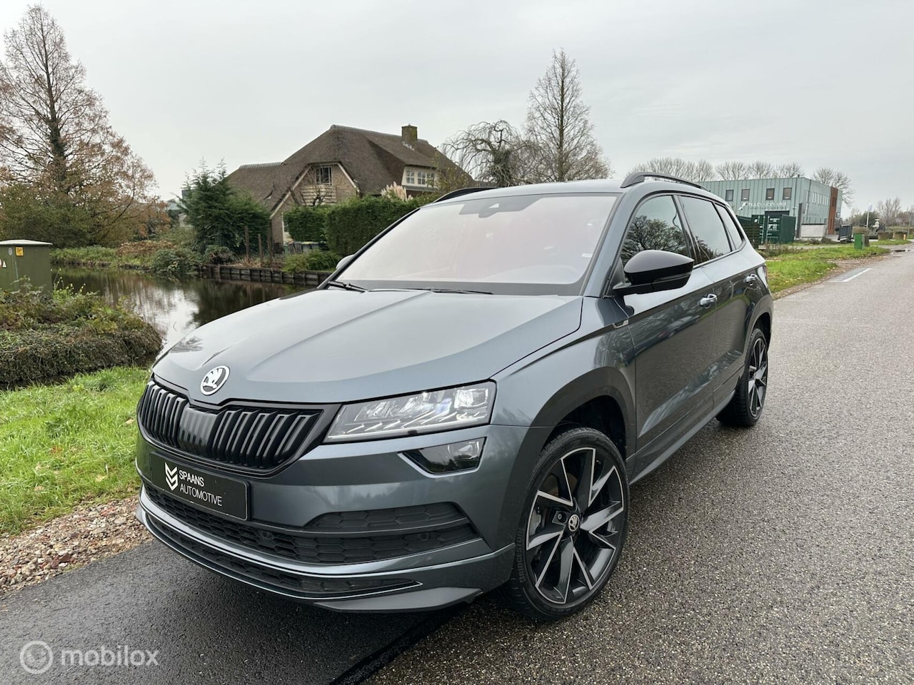 Skoda Karoq - 1.5 TSI DSG Sportline / Navi / ACC / CarPlay - AutoWereld.nl