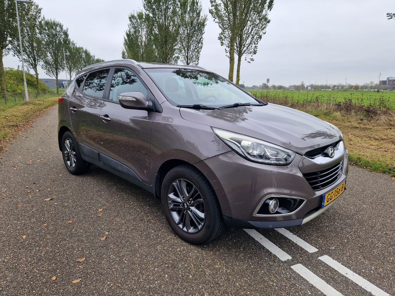 Hyundai ix35 - 1.6i GDI Business Edition Leer | alle plaatsen stoel verwarming | Camera | P-sensoren | led | complete auto - AutoWereld.nl