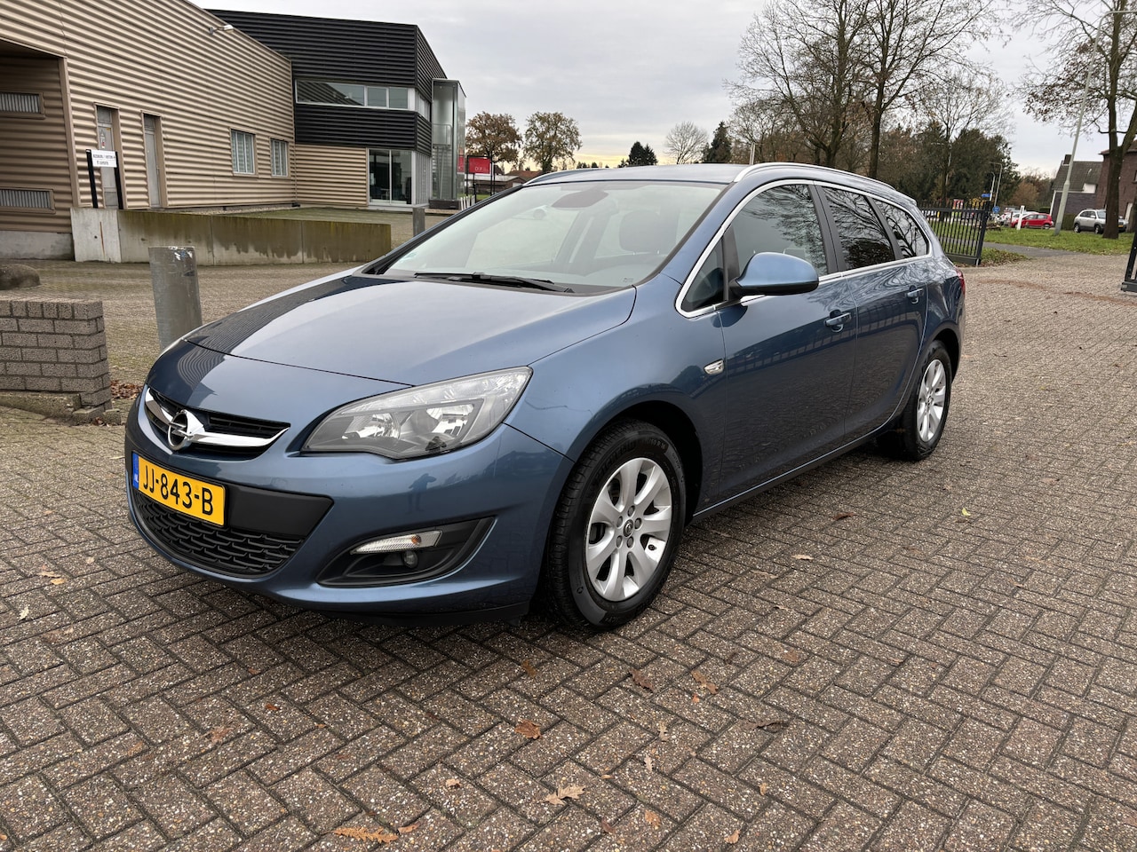 Opel Astra Sports Tourer - 1.4 Turbo Blitz [ fm navi,airco,cruise,lmv,trekhaak ] - AutoWereld.nl