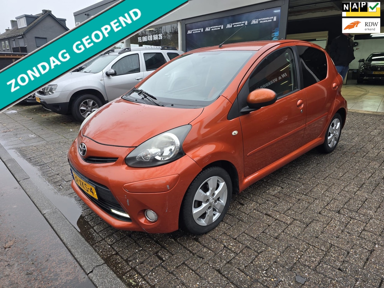 Toyota Aygo - 1.0 VVT-i Dynamic Orange | 1E EIGENAAR | 12MND GARANTIE | AIRCO | ELEC PAKKET | - AutoWereld.nl