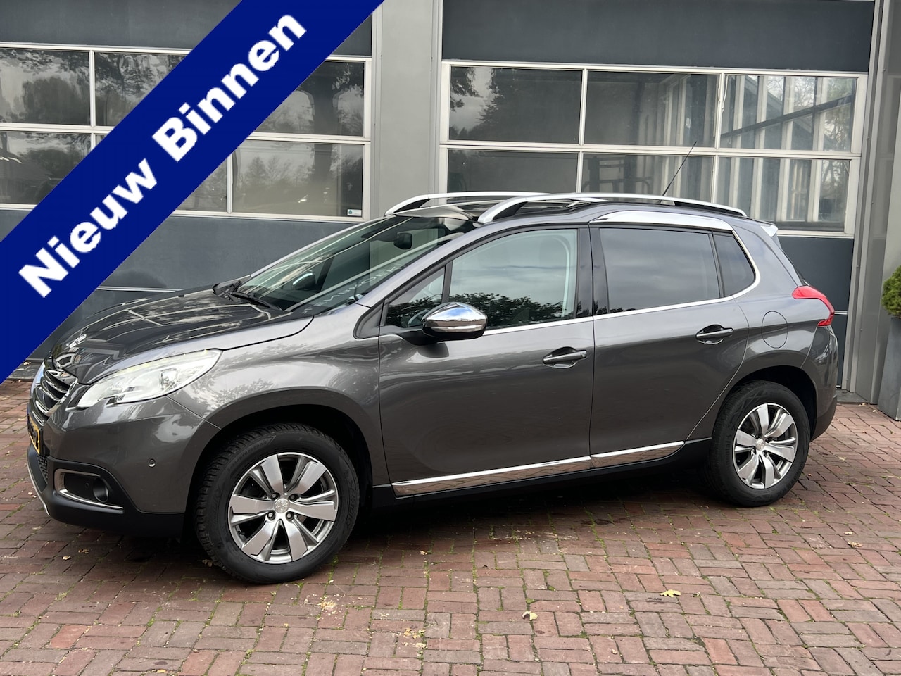 Peugeot 2008 - 1.2 PureTech Allure Clima Navi panodak  04-2016 136.146 KM - AutoWereld.nl