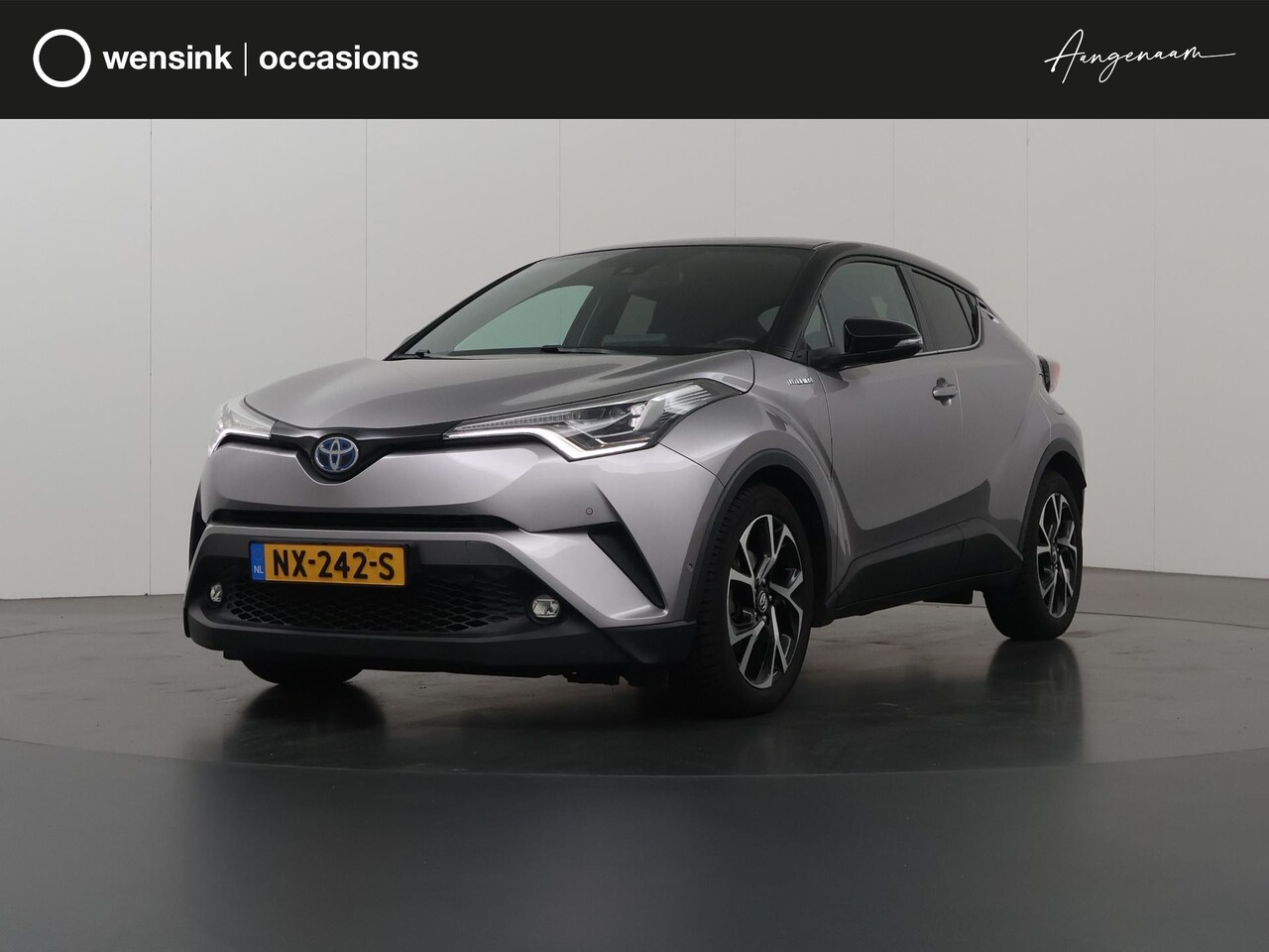 Toyota C-HR - 1.8 Hybrid Bi-Tone Plus | Navigatie | Parkeercamera | Keyless Go | Cruise Control - AutoWereld.nl