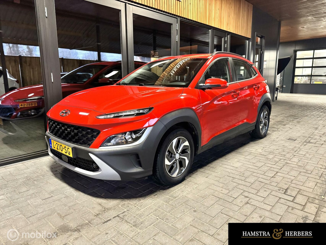 Hyundai Kona - 1.6 GDI HEV Comfort rood - AutoWereld.nl