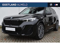 BMW iX1 - xDrive30 High Executive M Sport / Panoramadak / Trekhaak / Sportstoelen / Adaptief M Onder