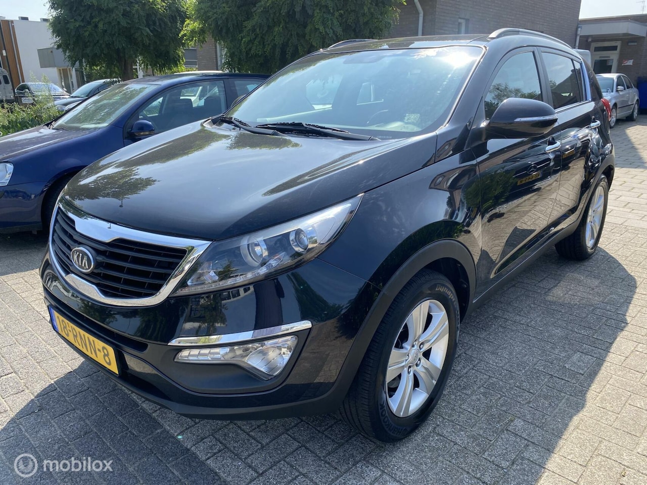 Kia Sportage - 1.6 GDI ISG X-ecutive Plus Pack 263.DKM ECC NAVIPANO CRUISE TREKHAAK - AutoWereld.nl