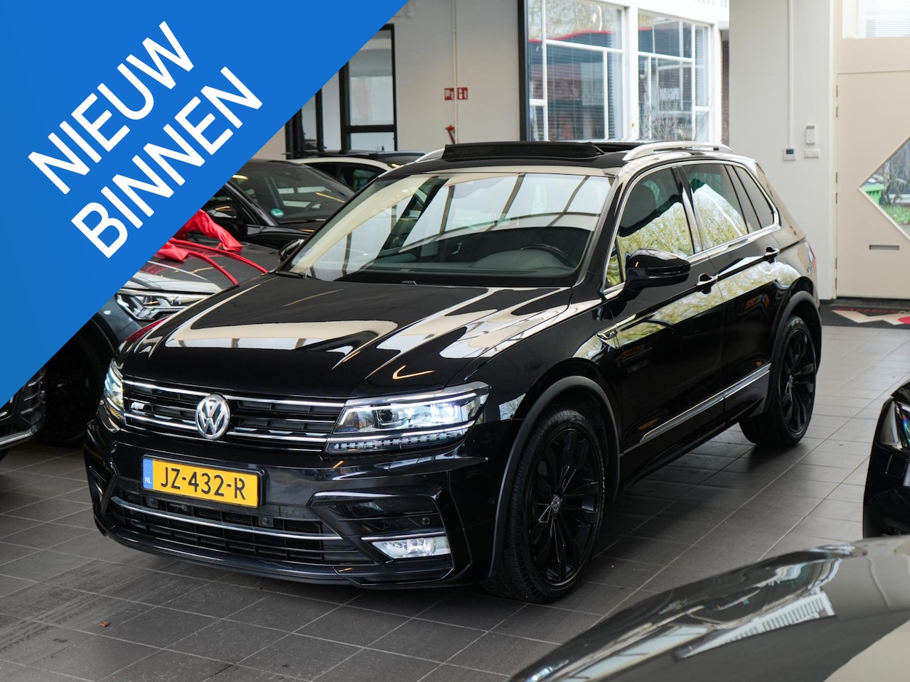 Volkswagen Tiguan - 1.4 TSI Pano Camera Navi R-line Massage - AutoWereld.nl