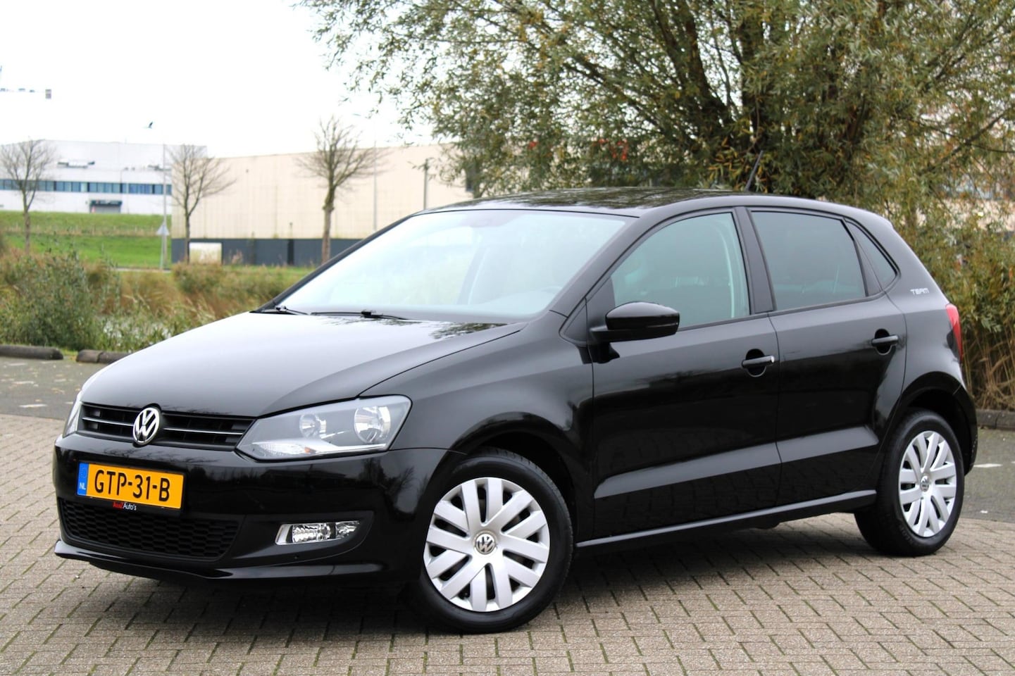 Volkswagen Polo - 1.2-12V Comfortline l Airco l Cruise l PDC - AutoWereld.nl