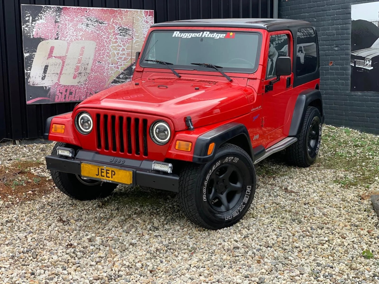 Jeep Wrangler - -THE RED RUGGED RIDGE EDITION- - AutoWereld.nl