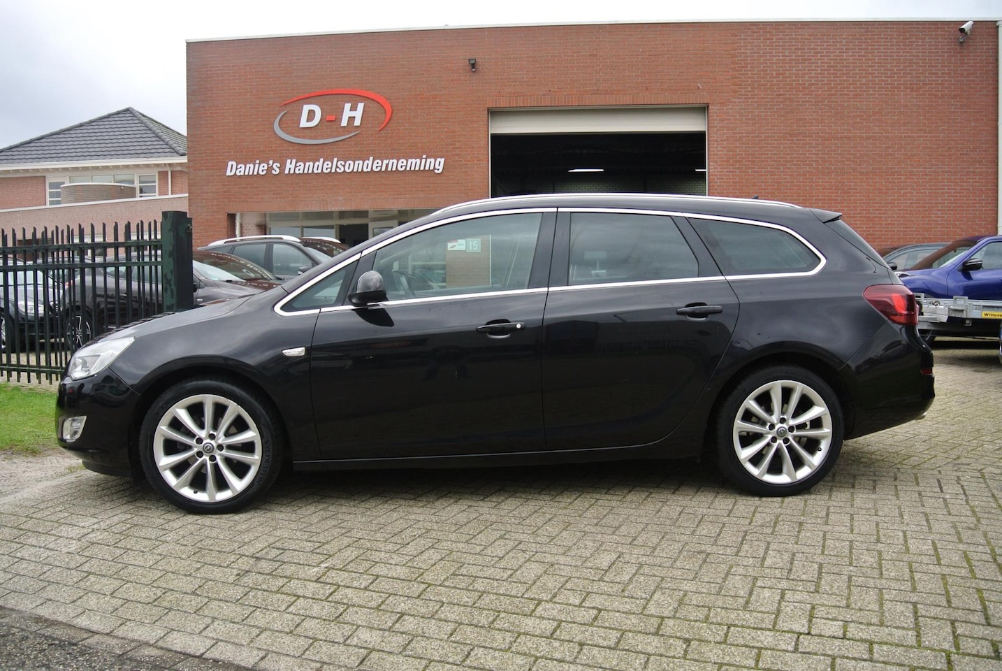 Opel Astra Sports Tourer - 1.4 Turbo Cosmo airco leder inruil mogelijk nap - AutoWereld.nl