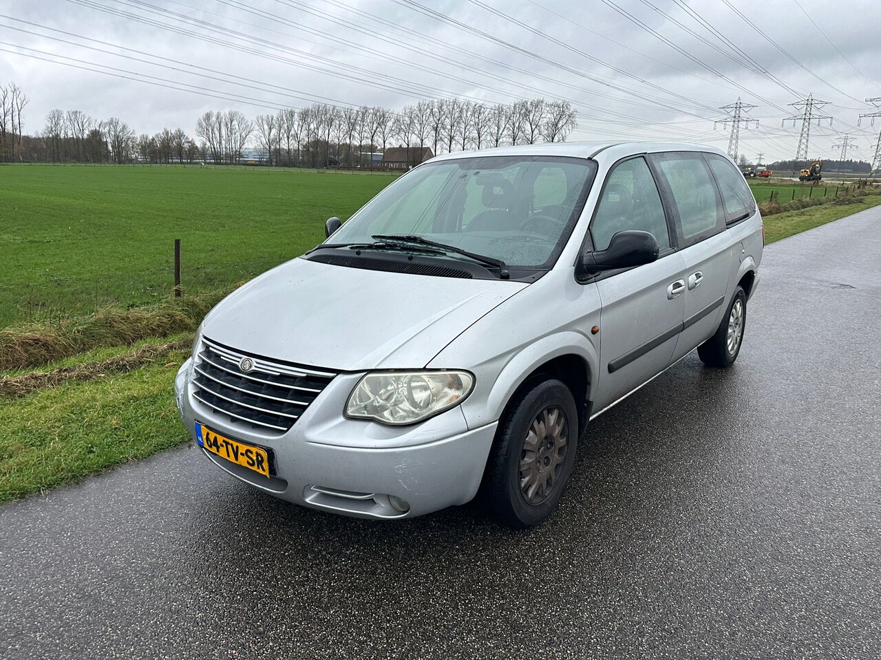 Chrysler Grand Voyager - 3.3i V6 SE Luxe AIRCO / 7 PERSOONS / NAP ! - AutoWereld.nl