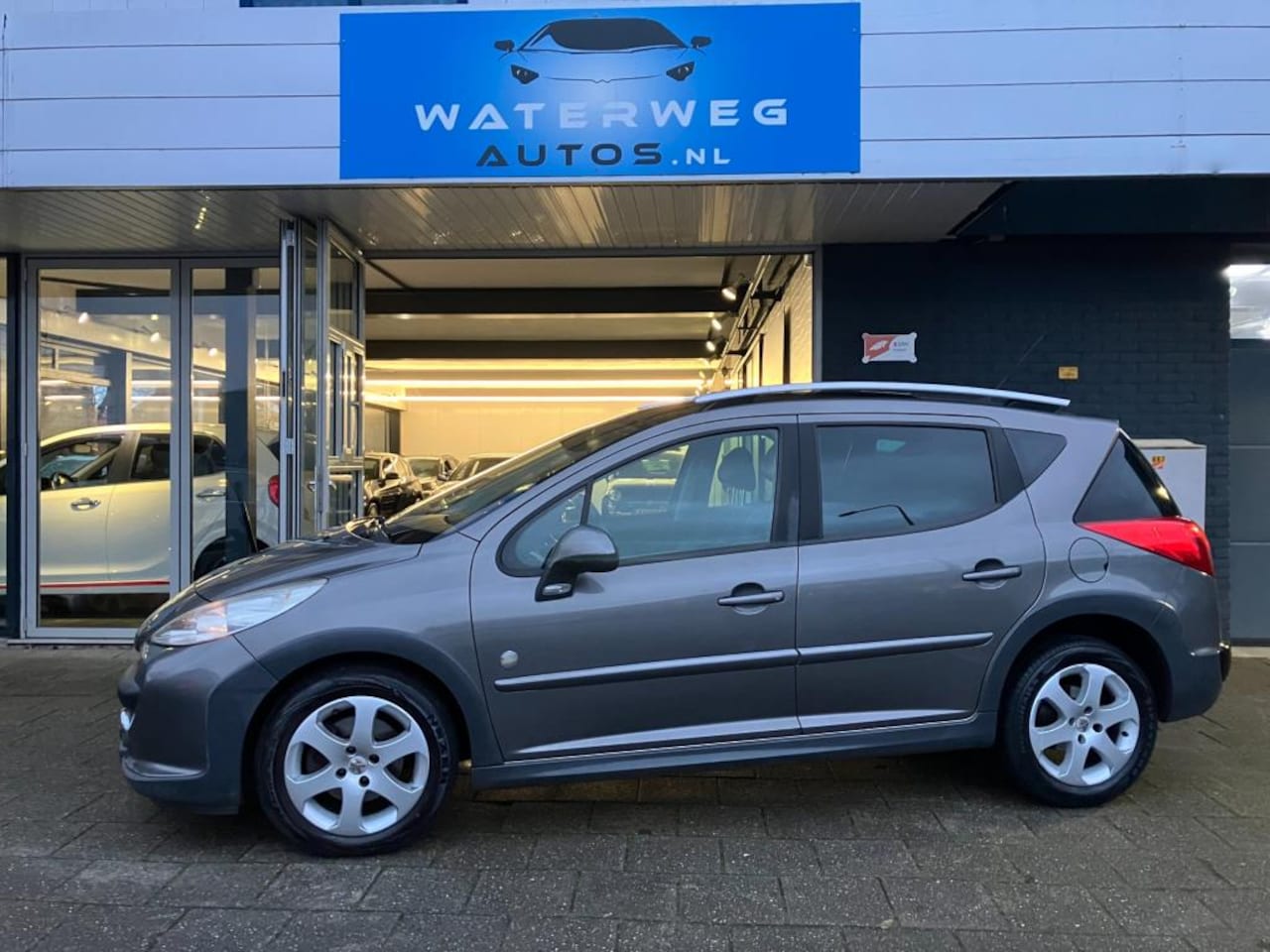 Peugeot 207 SW Outdoor - 1.6 VTi XS Panodak/Clima/elektrisch pakket/Lm velgen - AutoWereld.nl