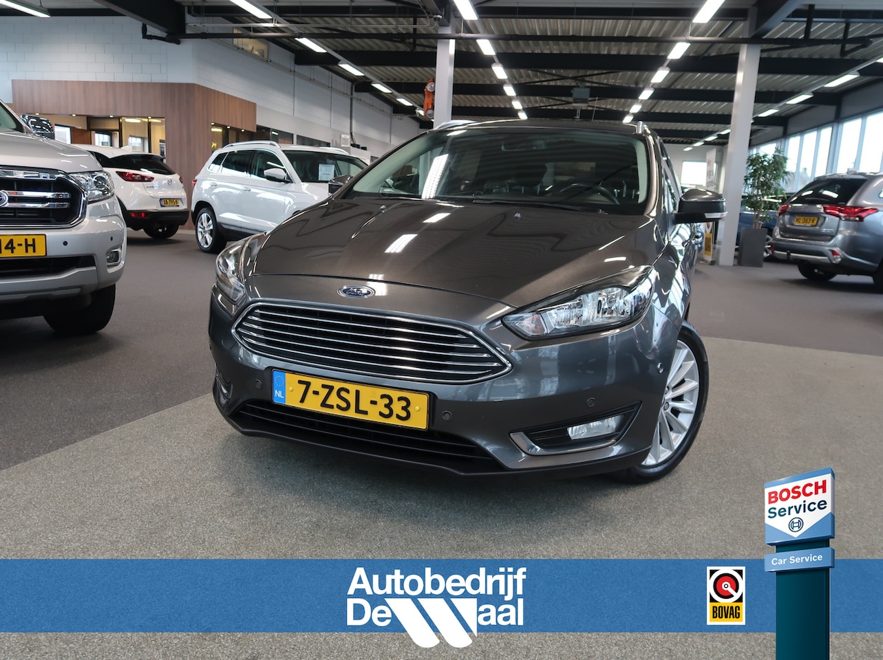 Ford Focus Wagon - 1.0 Ecob. 125pk Titanium First Edition NAVI/CLIMA/CRUISE/PDC/TREKH./VOORRUITVERWARMING - AutoWereld.nl