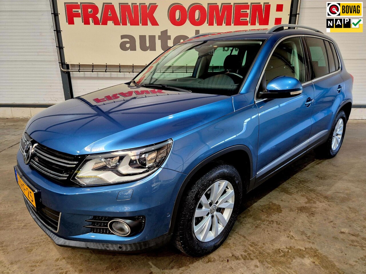 Volkswagen Tiguan - 1.4 TSI 161PK Sport&Style 4Motion + 1e eigenaar|Dealer OH|Bi xenon|Park assist|Navi|Alcant - AutoWereld.nl