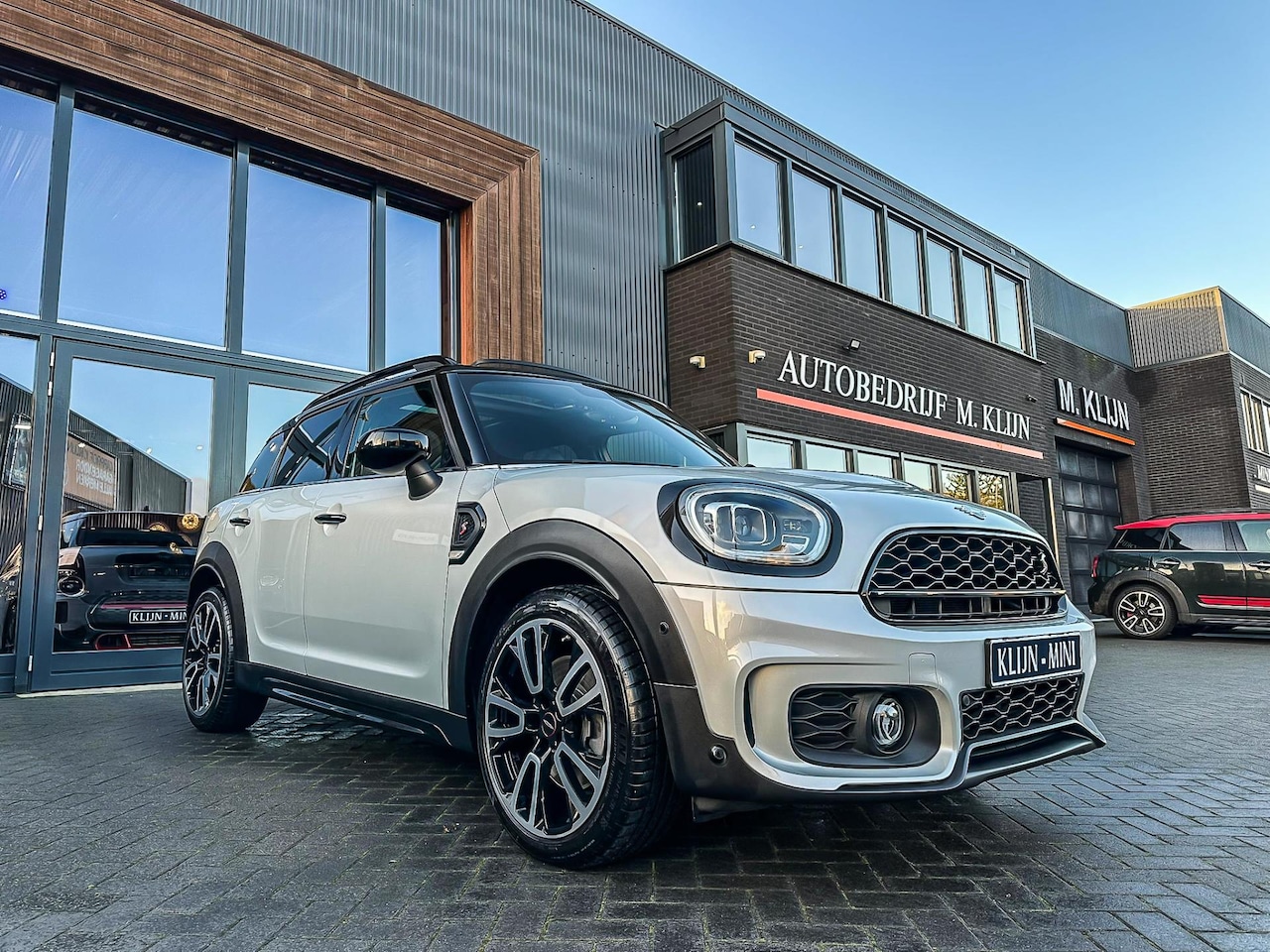 MINI Countryman - Mini 2.0 Cooper S John Cooper Works F1 aut/lounge leer/camera/pano/19"/btw/vol - AutoWereld.nl