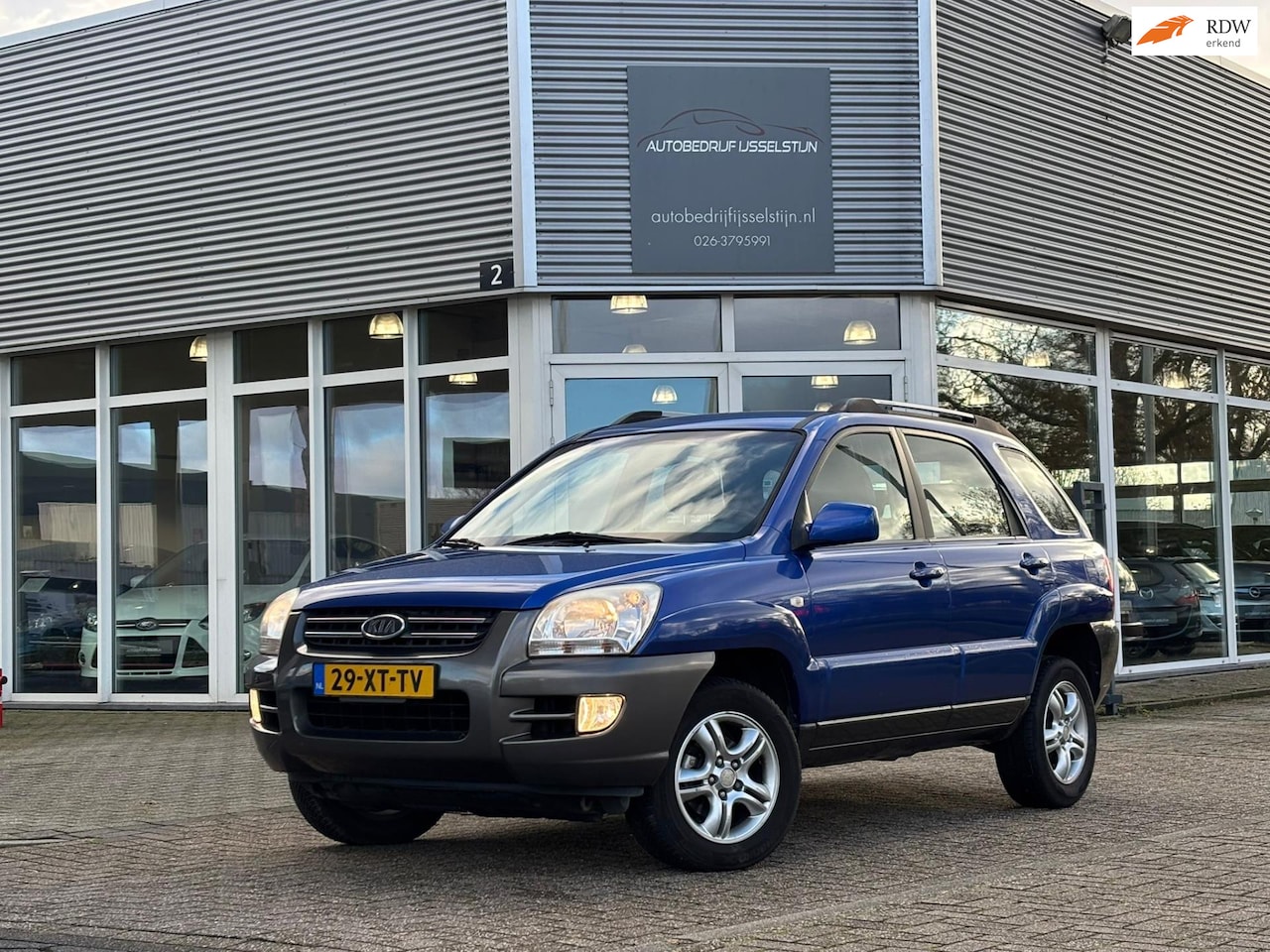 Kia Sportage - 2.0 CVVT Executive / Airco / Half Leder / Cruise Control. - AutoWereld.nl