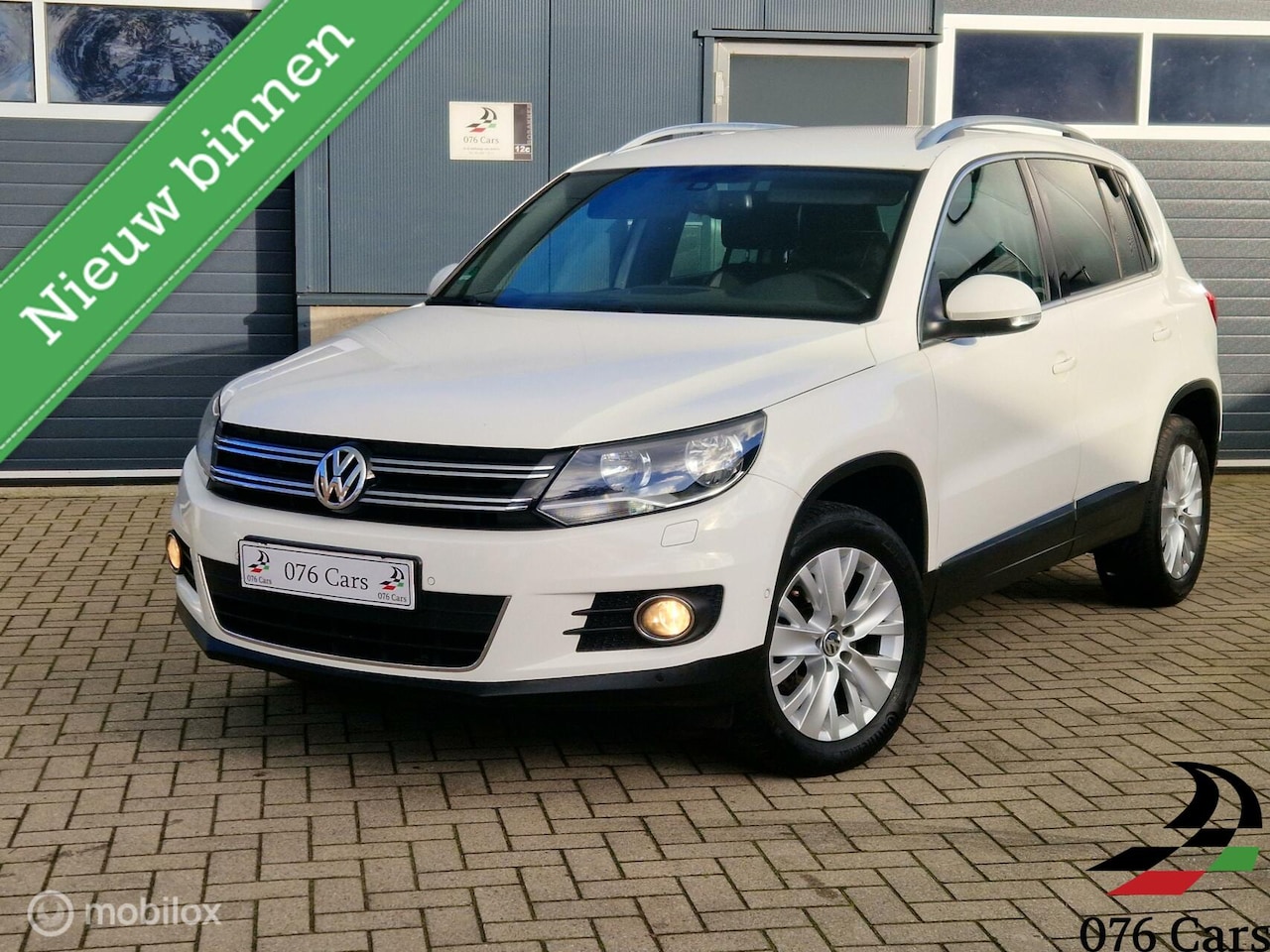 Volkswagen Tiguan - 1.4 TSI 122 PK Highline / 2e EIG / CRUISE / PDC / STUURWIELBED. / - AutoWereld.nl